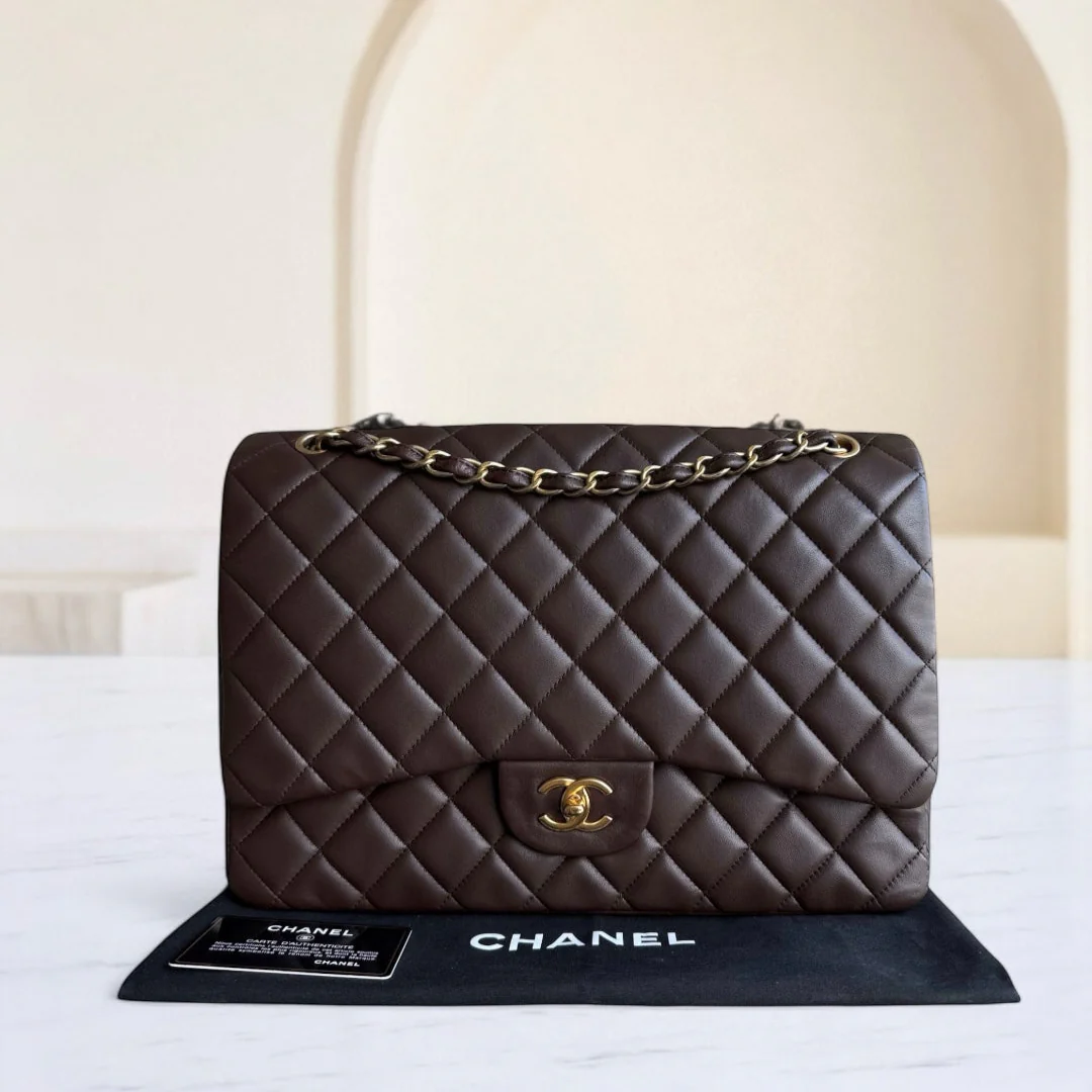 Chanel handbag on a stand with a neutral background